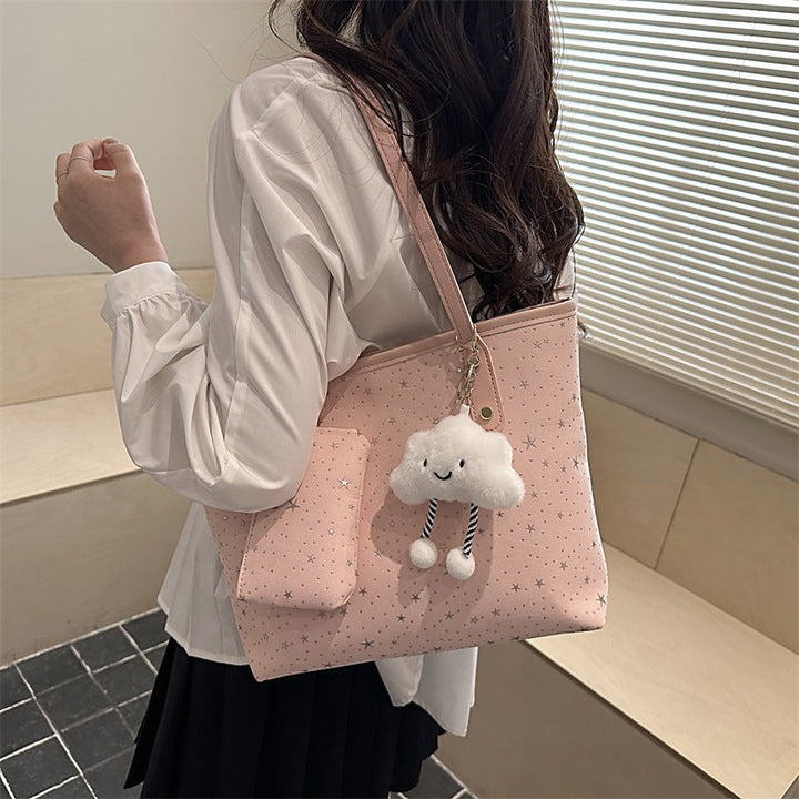 Women's large tote bag with sparkling star design and detachable cosmetic pouch