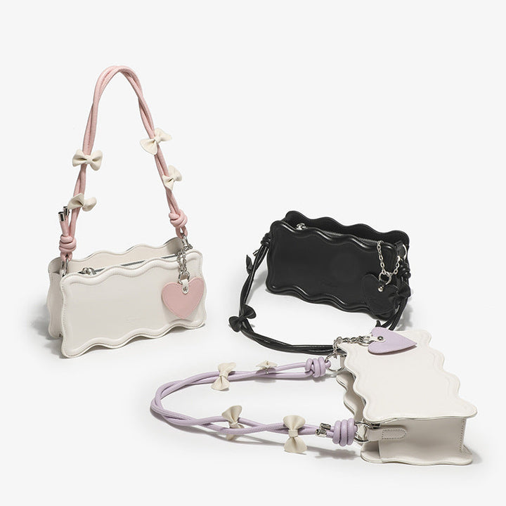 Ladies mini handbag with creative wave pattern and playful pendant