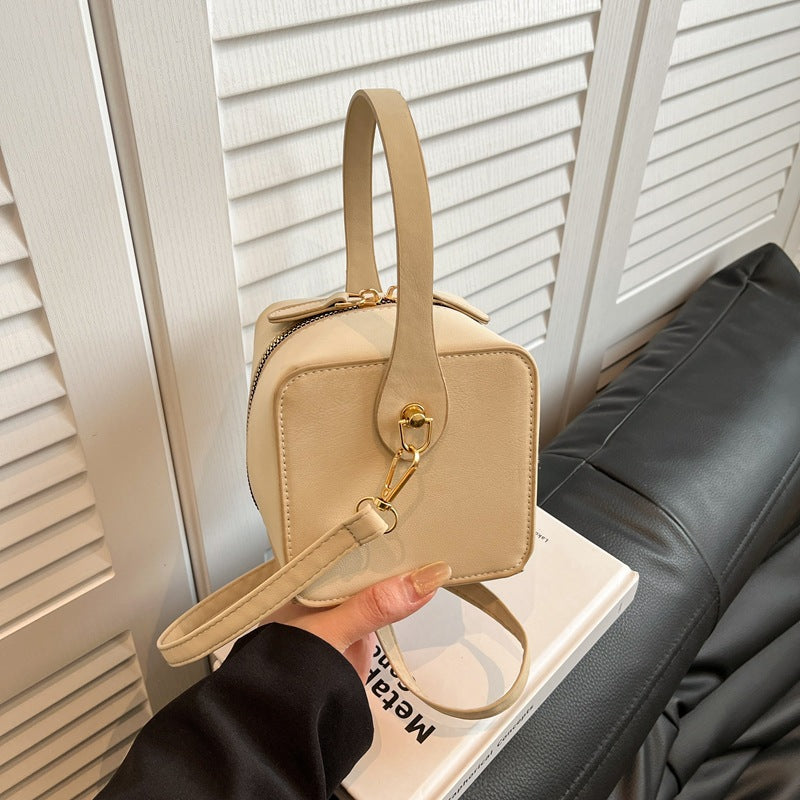 Ladies mini handbag with removable shoulder strap and elegant flap closure