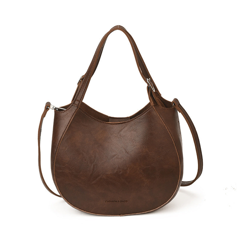 Women's shoulder bag made of high-quality artificial leather with fashionable trim