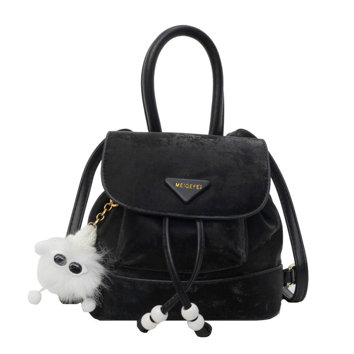 Women's mini backpack with playful design and plush pendant