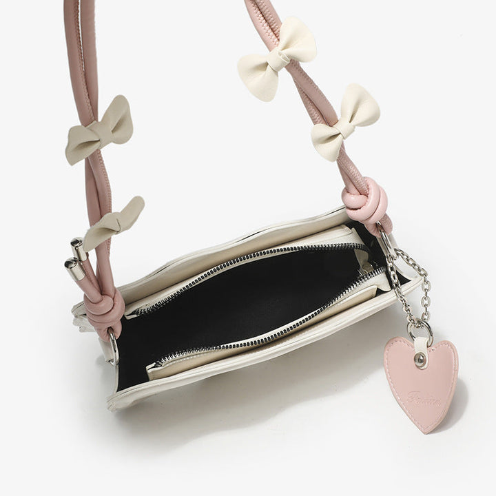 Ladies mini handbag with creative wave pattern and playful pendant
