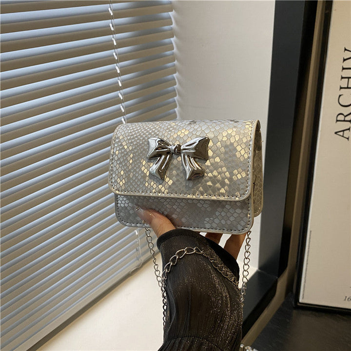 Women's clutch with playful bow design