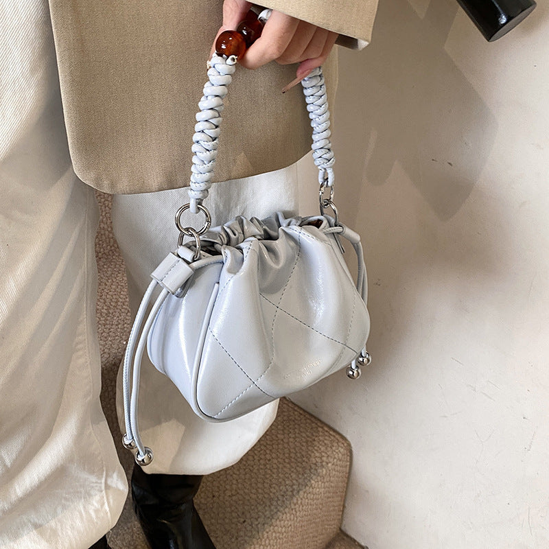 Ladies mini shoulder bag with decorative chain strap and trendy charm