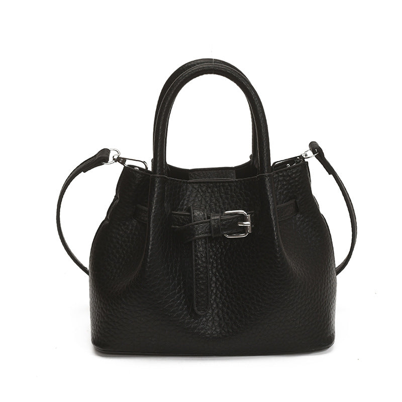 Women's mini handbag with stylish button closure
