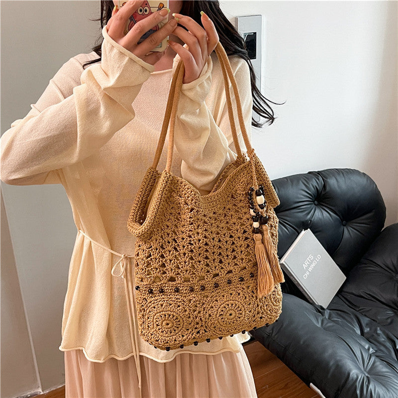 Ladies crocheted shoulder bag with decorative fringes and unique accents