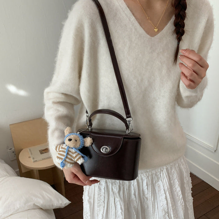 Women’s mini handbag with cute animal pendant