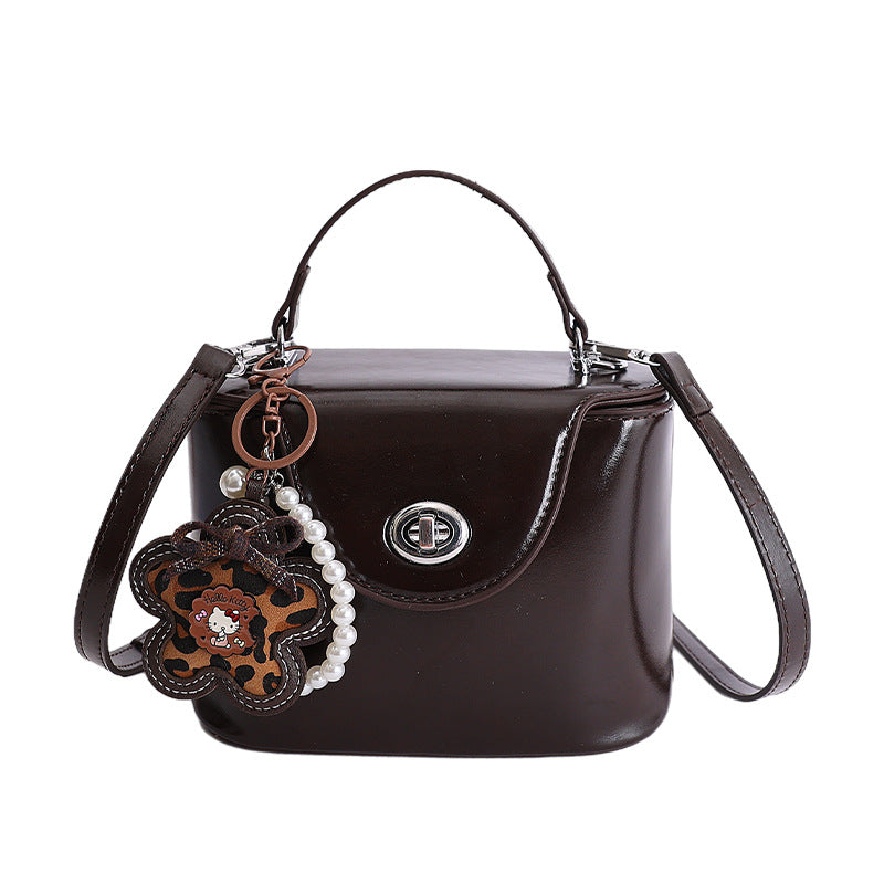 Ladies elegant mini handbag with stylish charm