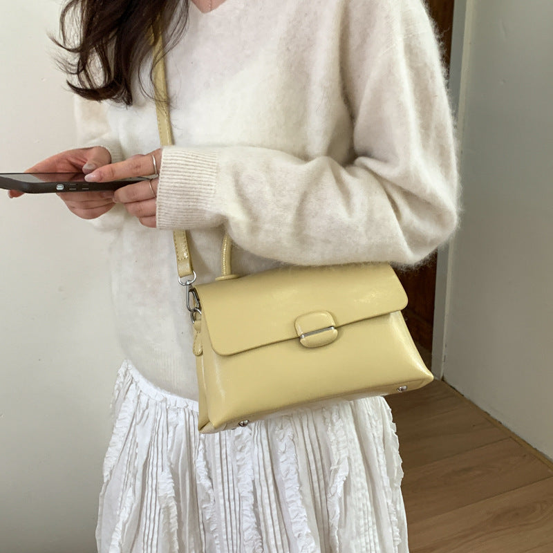 Women's handbag with textured design and elegant closure
