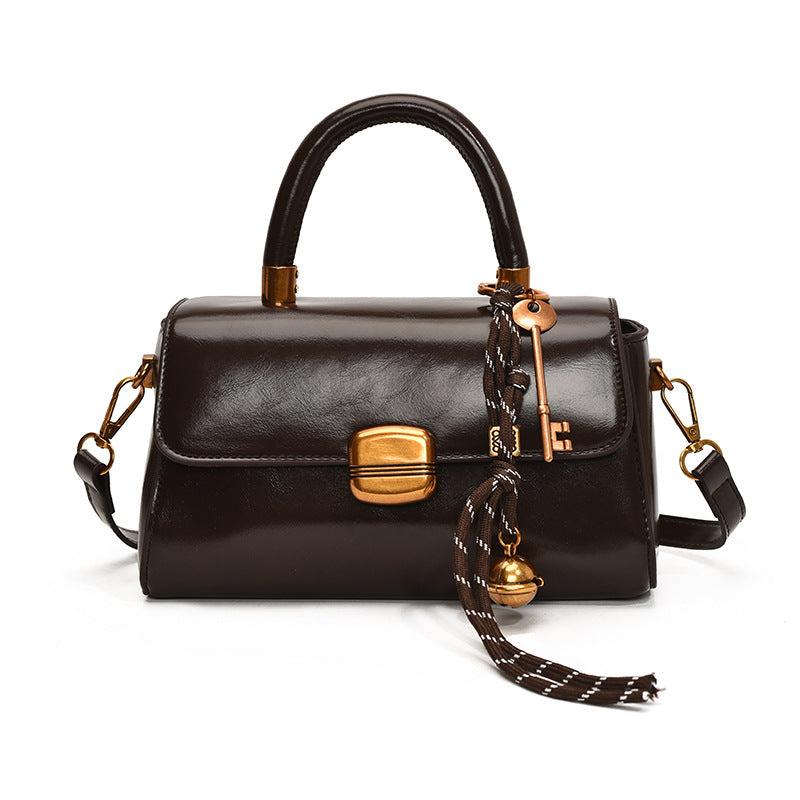 Women's elegant handbag with golden accents