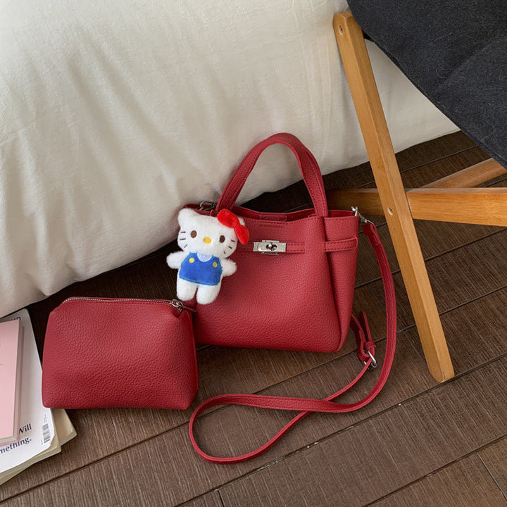 Ladies mini handbag with detachable cosmetic pouch