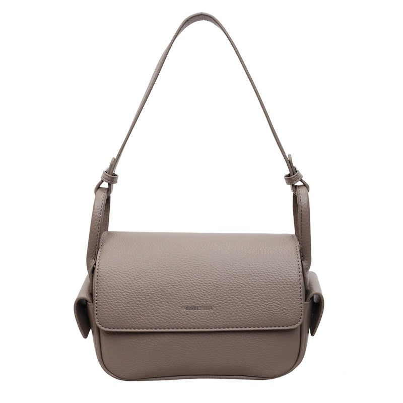 Women’s shoulder bag made of soft, textured leather with adjustable shoulder strap