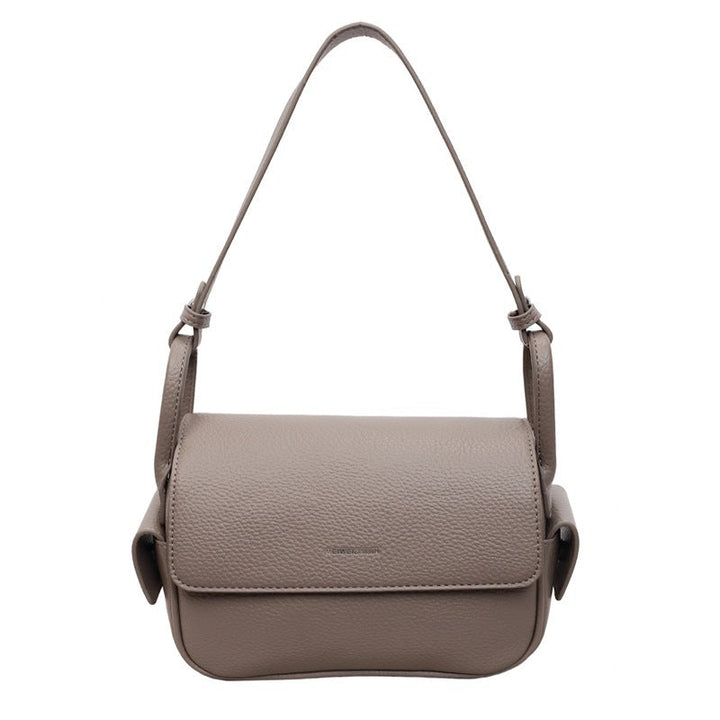 Women’s shoulder bag made of soft, textured leather with adjustable shoulder strap