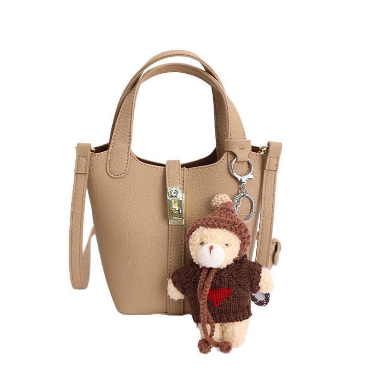 Women's mini handbag with playful animal charm