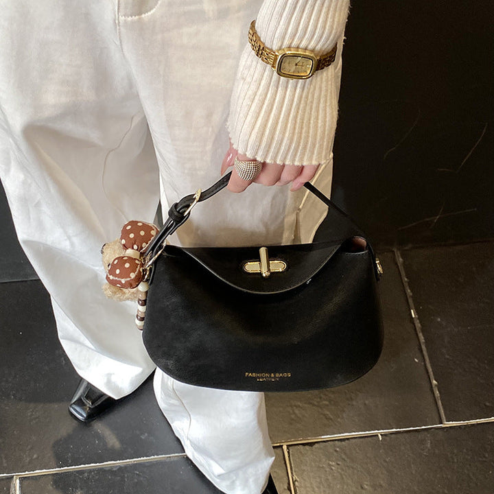 Women's shoulder bag with decorative pendant