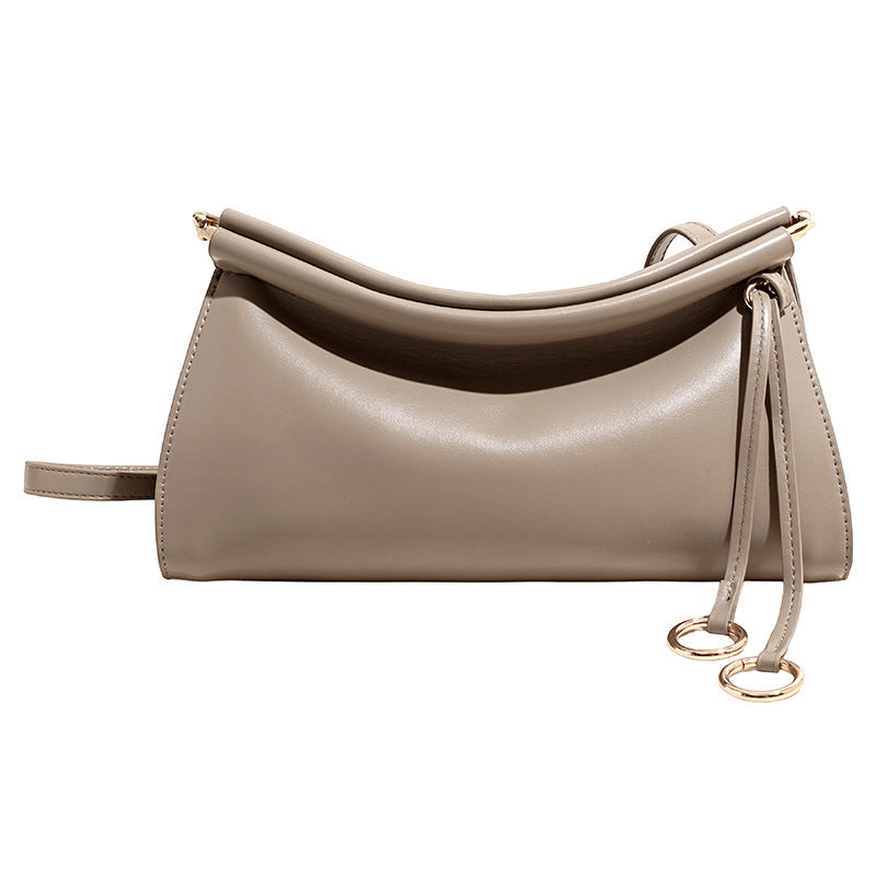 Women's elegant shoulder bag with modern, curved design