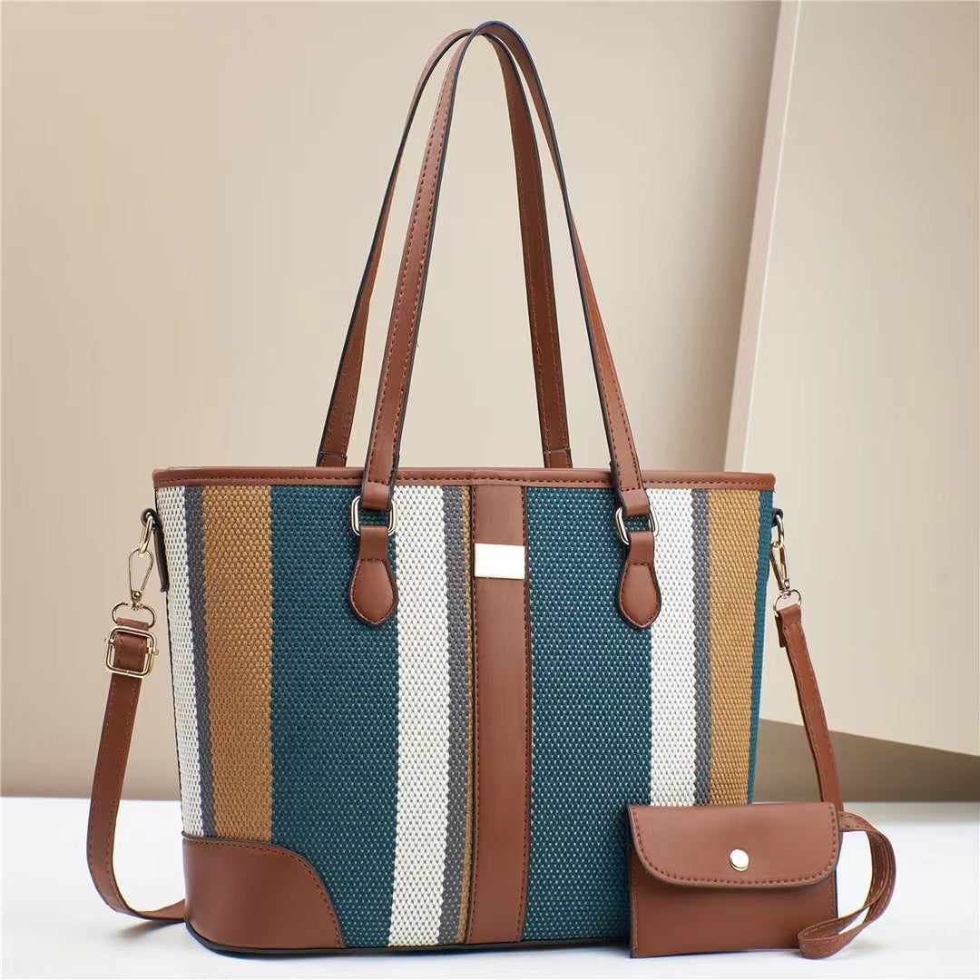 Women's tote bag with textured outer material and removable mini clutch