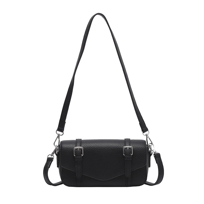 Women's elegant shoulder bag made of textured synthetic leather with adjustable shoulder strap
