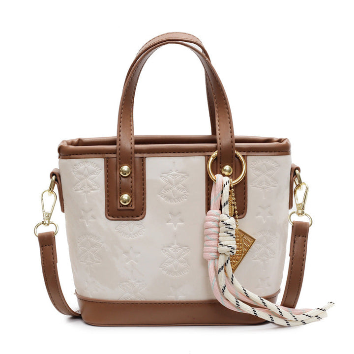 Ladies mini bag in playful design with decorative charm