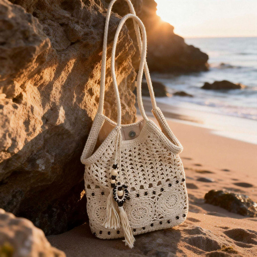 Ladies crocheted shoulder bag with decorative fringes and unique accents