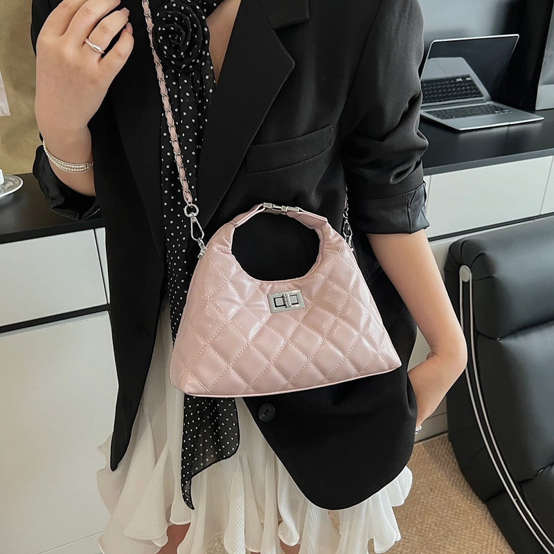Women's mini bag with elegant quilted design and chic chain closure