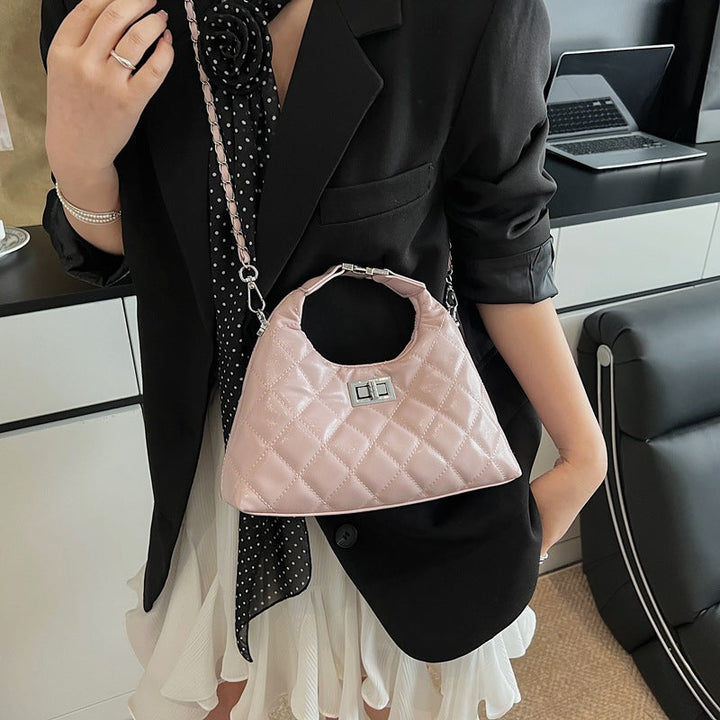 Women's mini bag with elegant quilted design and chic chain closure