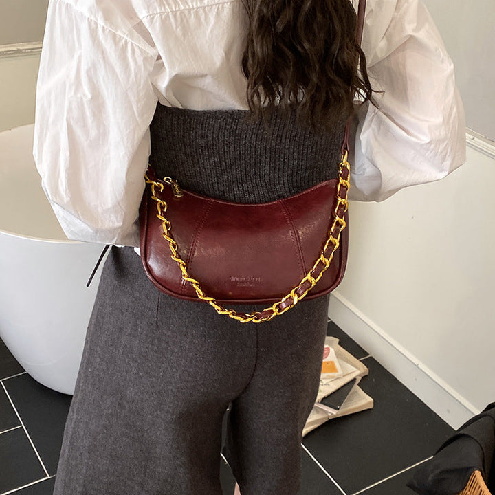 Women's shoulder bag with elegant chain accent