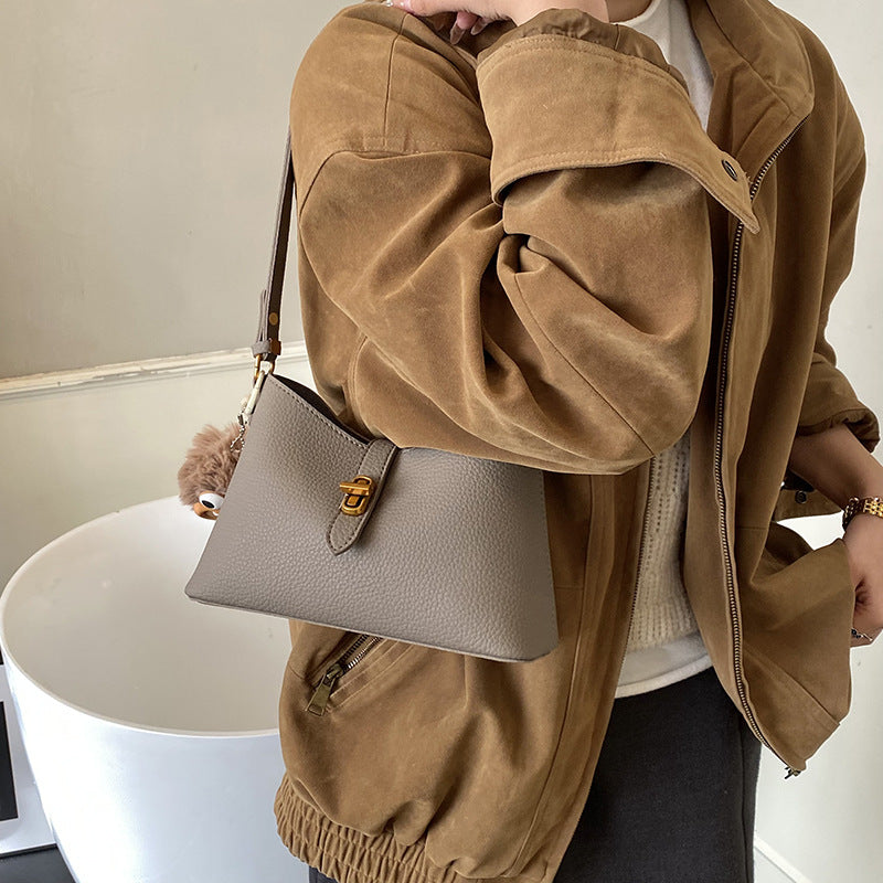 Women's multifunctional shoulder bag with playful charm