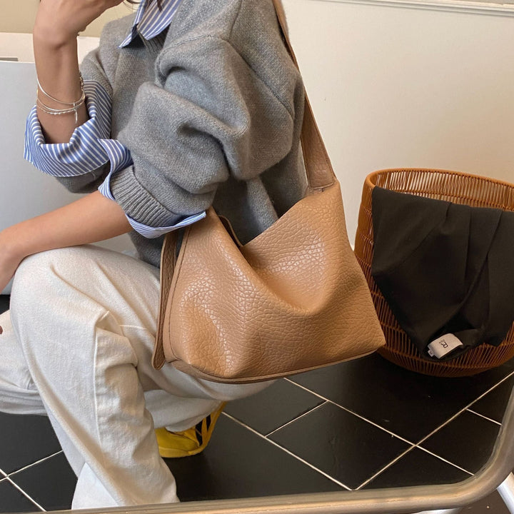 Women stylish shoulder bag with textured design