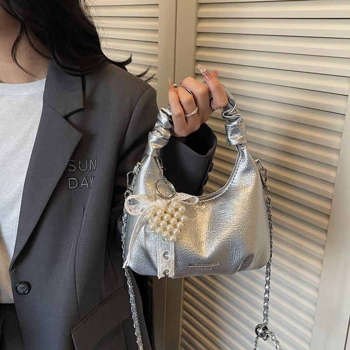 Ladies mini handbag with voluminous ruffle design and trendy charms
