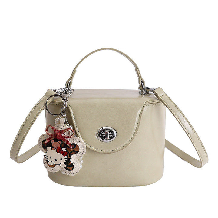 Ladies elegant mini handbag with stylish charm