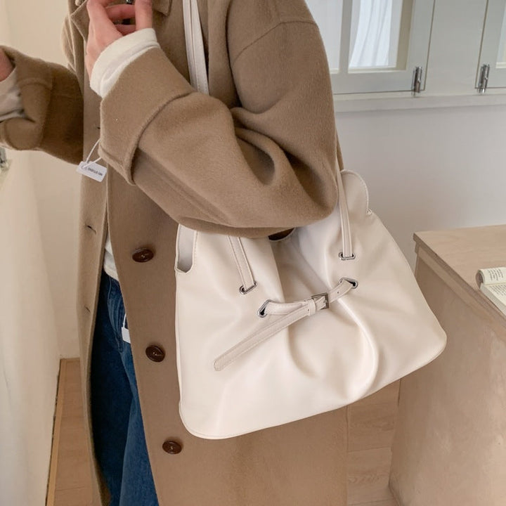 Women's shoulder bag made of high-quality synthetic leather with adjustable drawstring