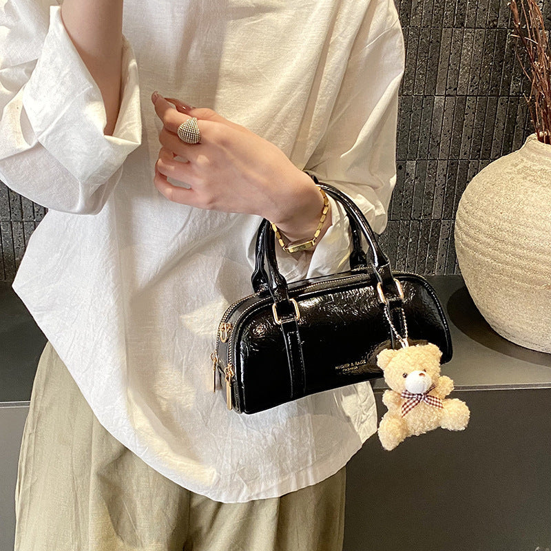 Women's mini handbag with playful teddy pendant