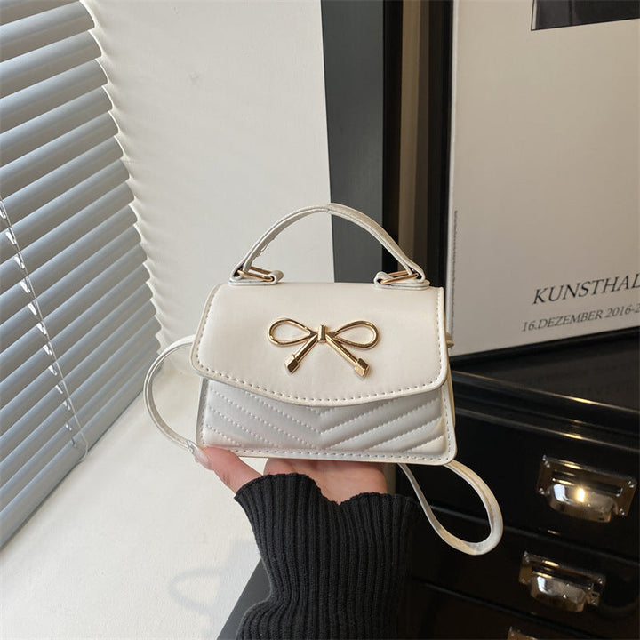 Women’s mini handbag with elegant bow decoration
