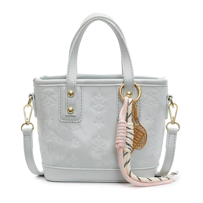 Ladies mini bag in playful design with decorative charm