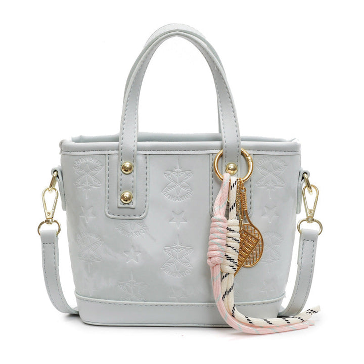 Ladies mini bag in playful design with decorative charm