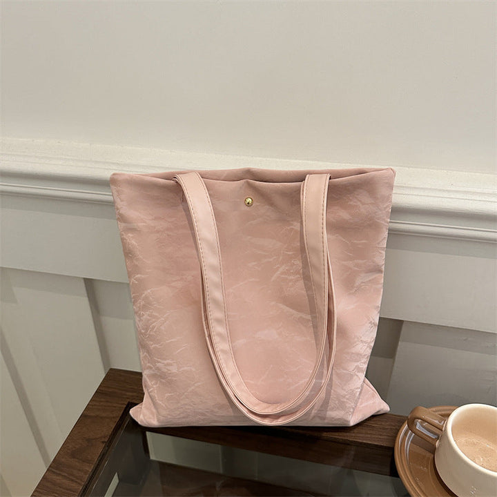 Women's tote bag made of high-quality synthetic leather with a textured surface