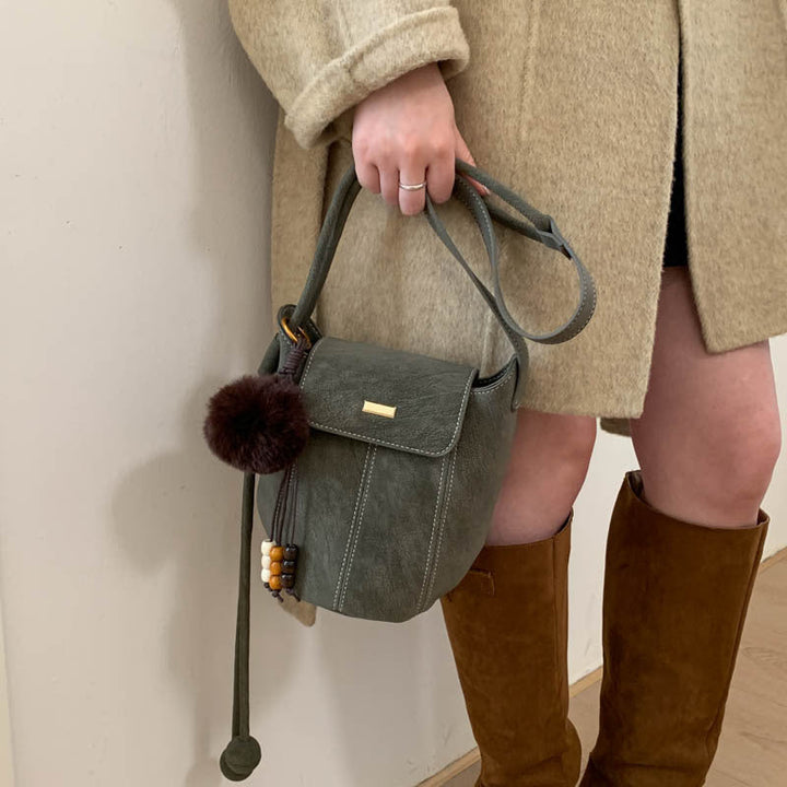 Ladies fashionable crossbody bag with fluffy pendant