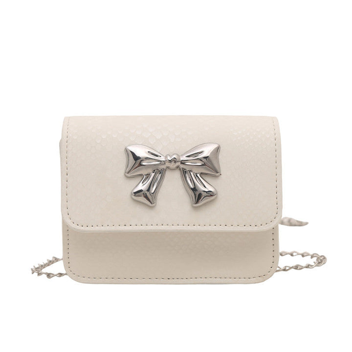 Women's clutch with playful bow design