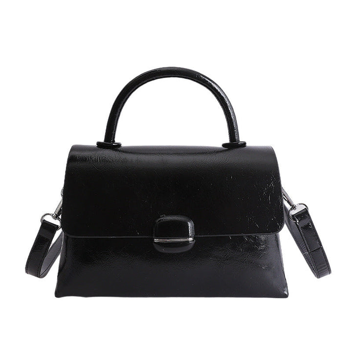 Women's handbag with textured design and elegant closure