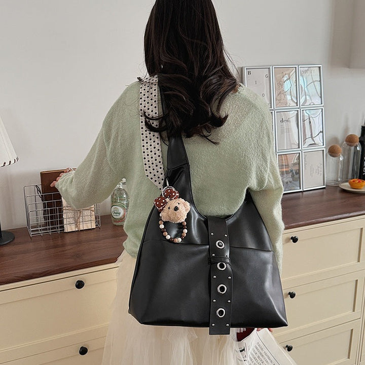 Ladies crossbody bag made of high-quality artificial leather with practical attachments