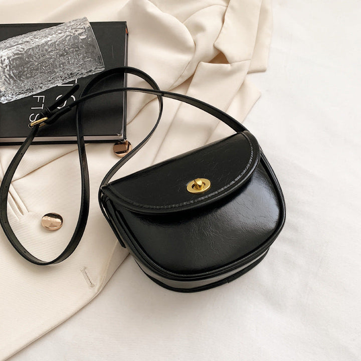 Women's shoulder bag in elegant retro design with golden accents