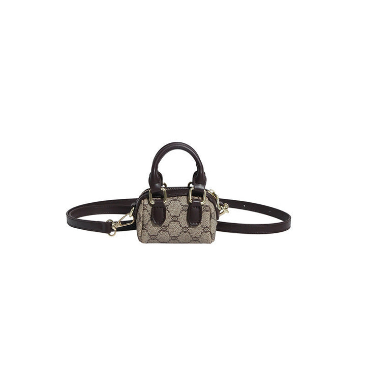 Ladies mini handbag with luxurious accents and adjustable shoulder strap