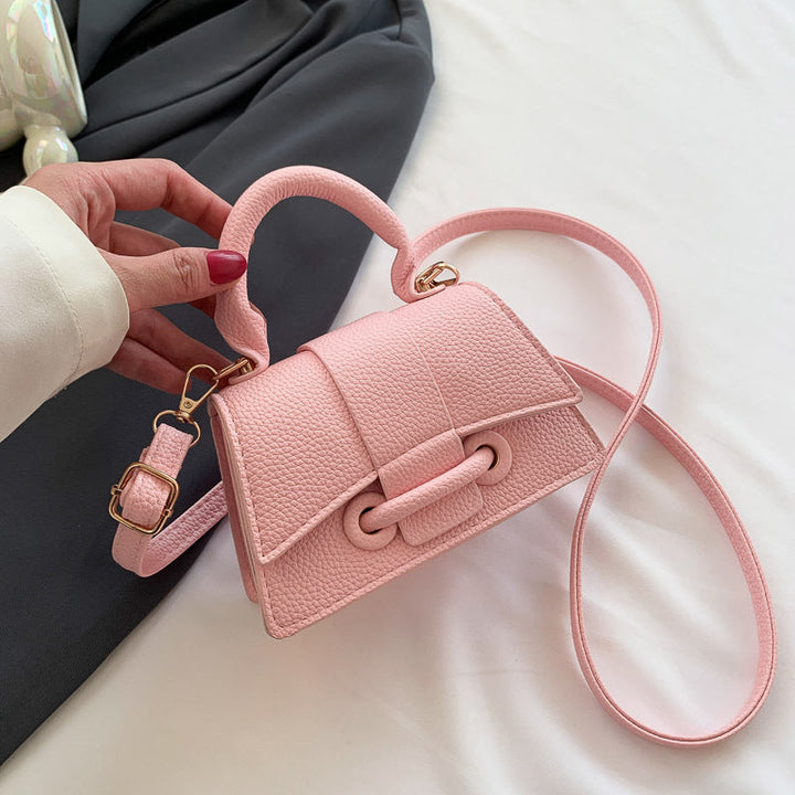 Women's mini handbag with textured leather and stylish closure