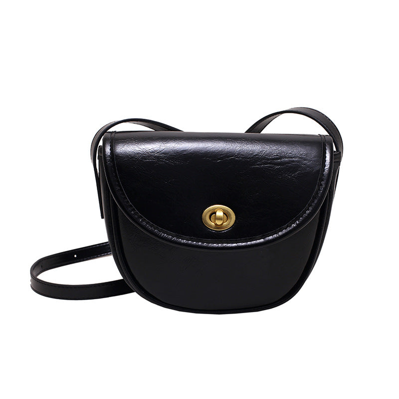 Women's shoulder bag in elegant retro design with golden accents