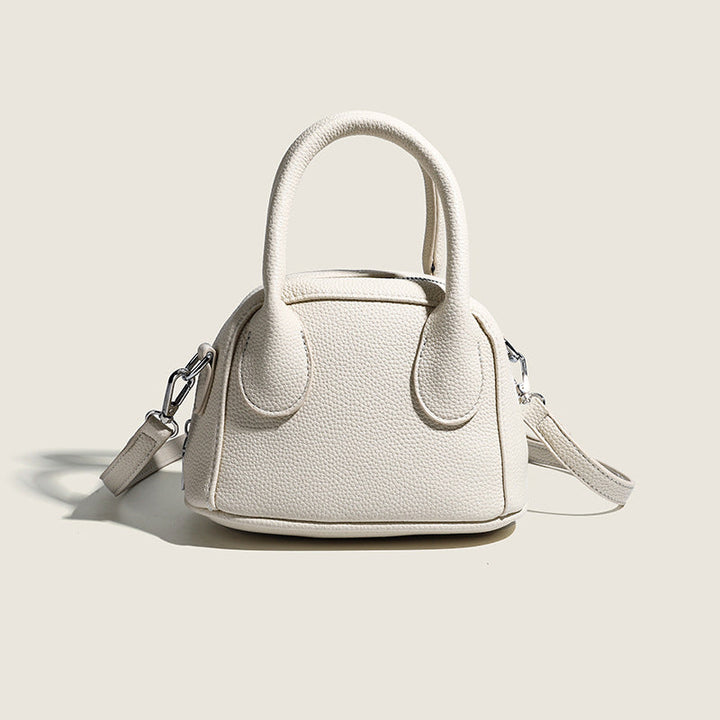 Women's mini handbag with structured exterior and detachable shoulder strap