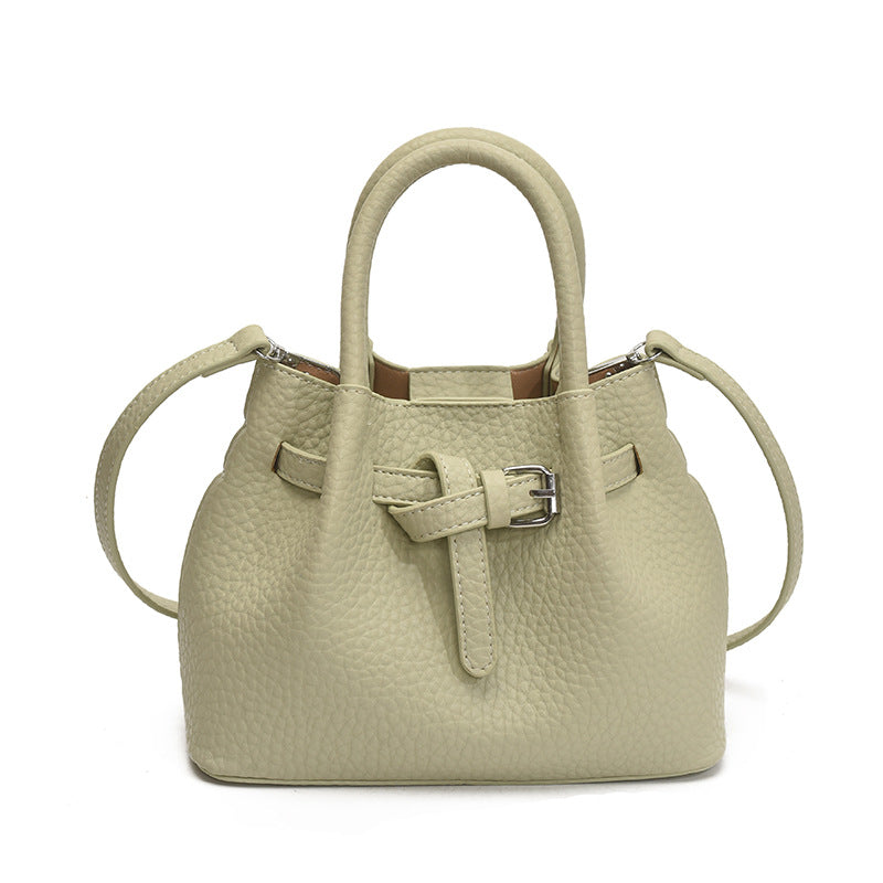 Women's mini handbag with stylish button closure