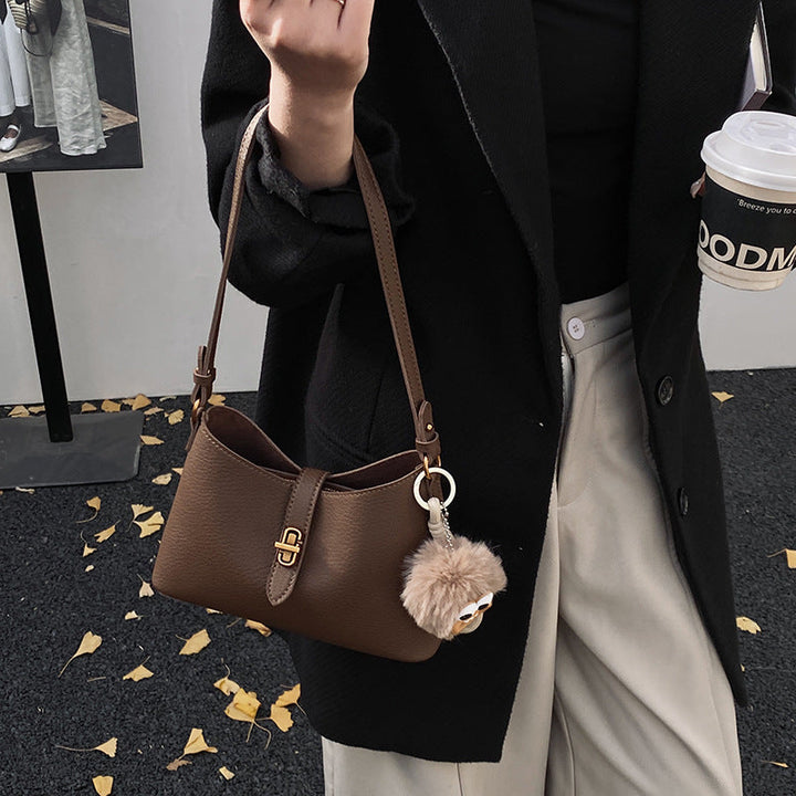Women's multifunctional shoulder bag with playful charm