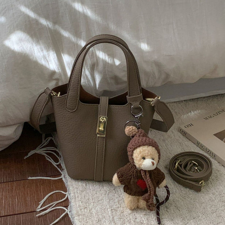 Women's mini handbag with playful animal charm