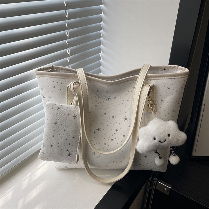 Women's large tote bag with sparkling star design and detachable cosmetic pouch